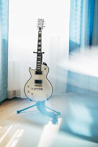 guitar white Les Paul guitar with stand leisure activities